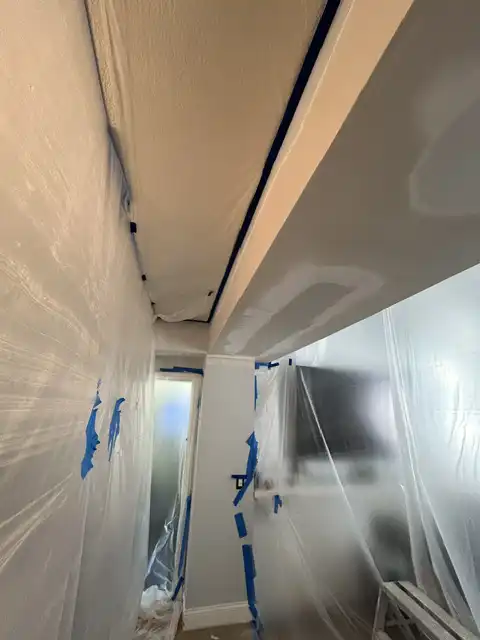 Small soffit water damage repair. Finish items protection, Demolition, drywall hanging, taping, corners application, matching existing texture and clean up. 2026 project photo